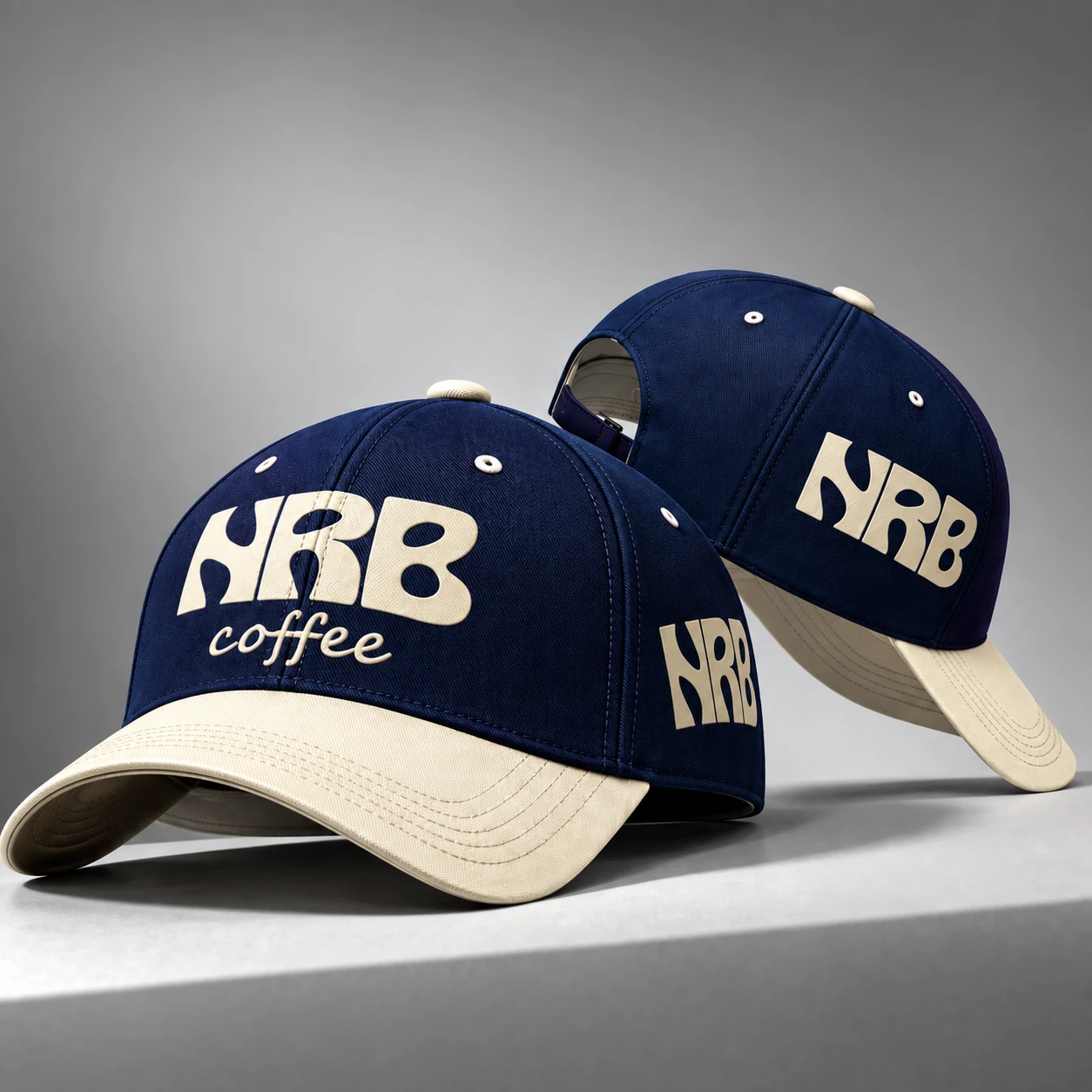 Navy and cream NRB cap concepts with repeated coffee wordmarks